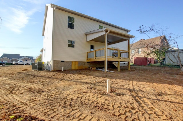 back of property featuring ceiling fan, crawl space, fence, a deck, and cooling unit