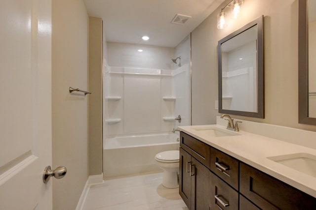 bathroom featuring visible vents, a sink, toilet, and double vanity