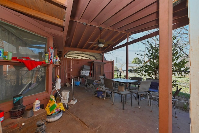 view of patio / terrace featuring a ceiling fan, outdoor dining space, and fence