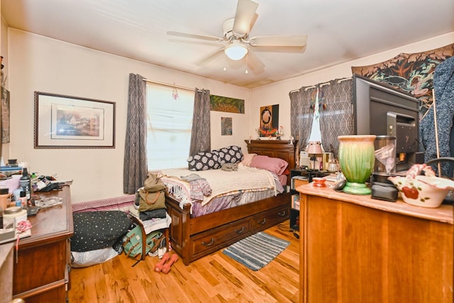 bedroom featuring ceiling fan and wood finished floors