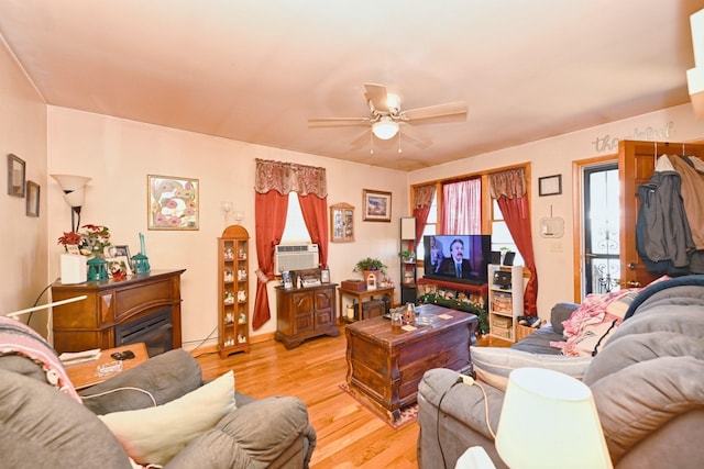 living area featuring a ceiling fan and light wood-style floors