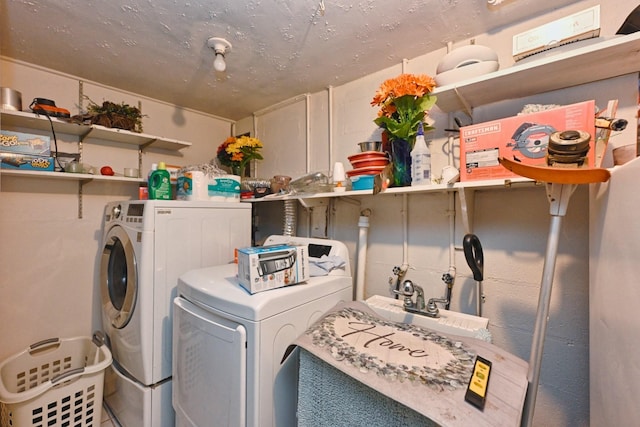 washroom featuring laundry area and separate washer and dryer