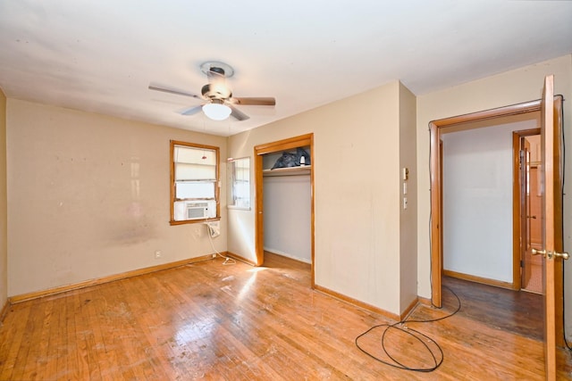 unfurnished bedroom featuring a closet, light wood-type flooring, and baseboards