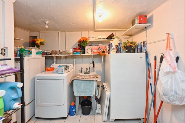 washroom featuring washer / dryer and light tile patterned floors