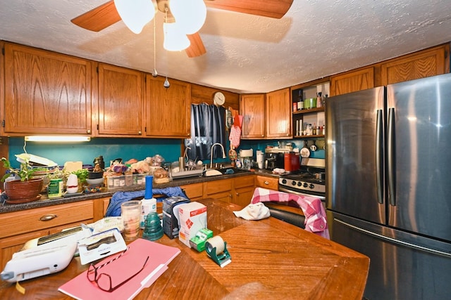 kitchen featuring stainless steel appliances, open shelves, brown cabinetry, and a sink