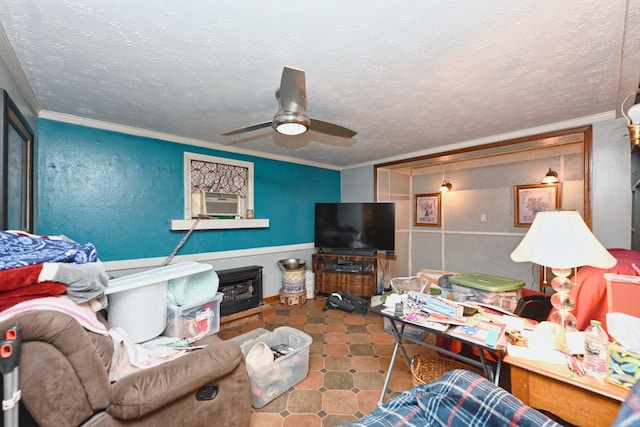 living room featuring ceiling fan, crown molding, and a textured ceiling