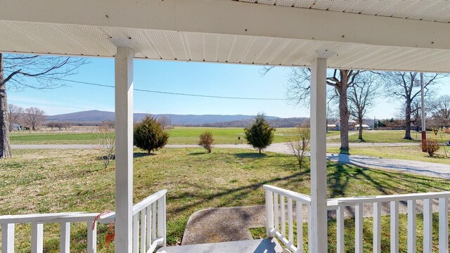 view of yard featuring a rural view and a mountain view