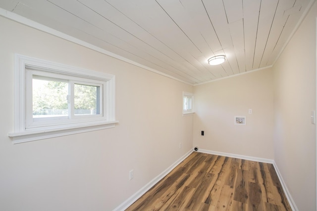 washroom featuring hookup for a washing machine, laundry area, wood finished floors, baseboards, and ornamental molding