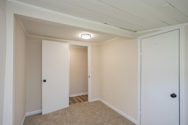 interior space with carpet and baseboards