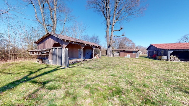 view of yard featuring an outbuilding and a storage unit