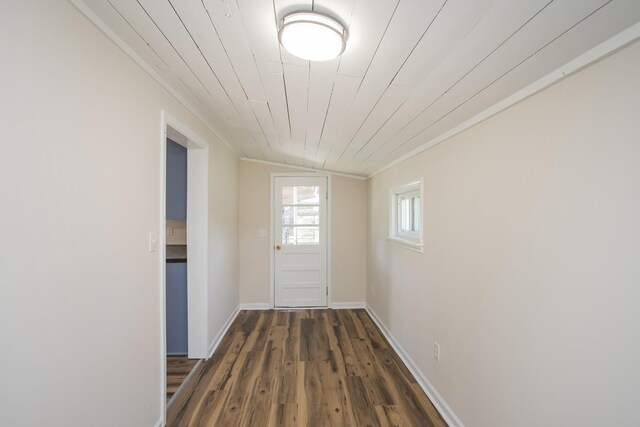 entryway with crown molding, dark wood-type flooring, wood ceiling, vaulted ceiling, and baseboards