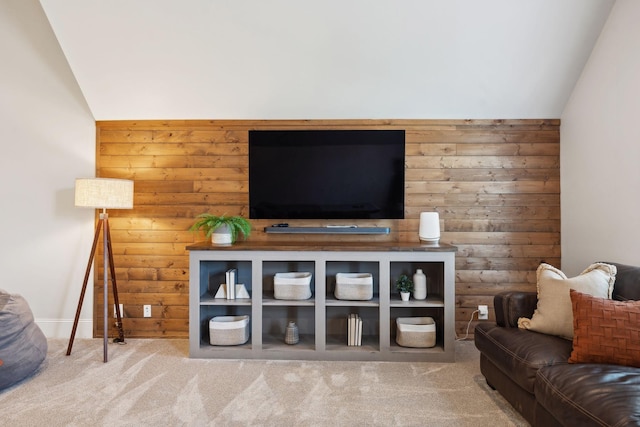 living area with carpet flooring and vaulted ceiling