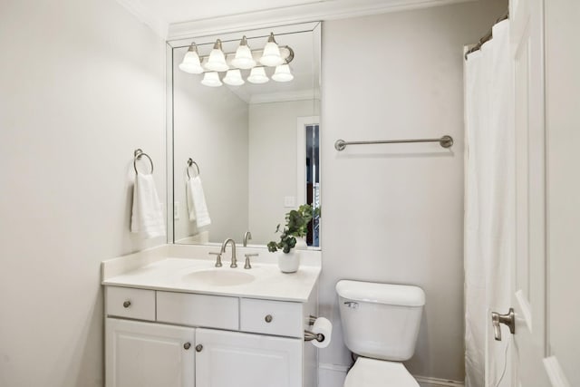 full bath with ornamental molding, vanity, and toilet