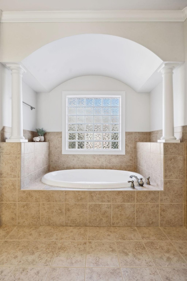 full bathroom with ornamental molding, tile patterned flooring, a bath, and ornate columns