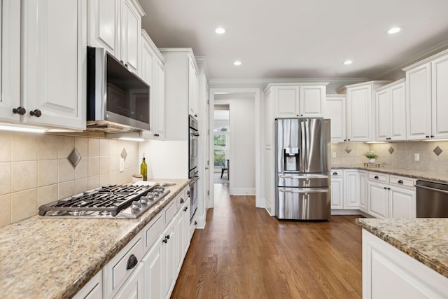 kitchen featuring stainless steel appliances and white cabinetry