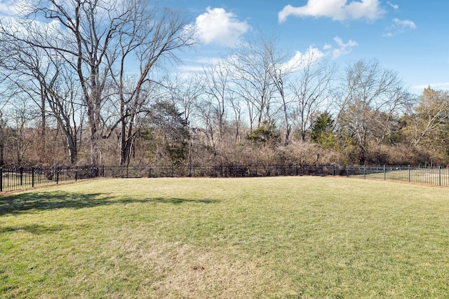 view of yard with a rural view and fence