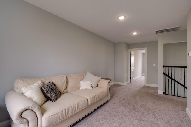 carpeted living room featuring recessed lighting, visible vents, and baseboards