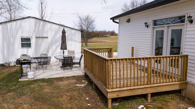 deck with outdoor dining area