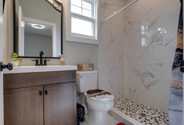 full bathroom with toilet, marble finish floor, a shower stall, and vanity