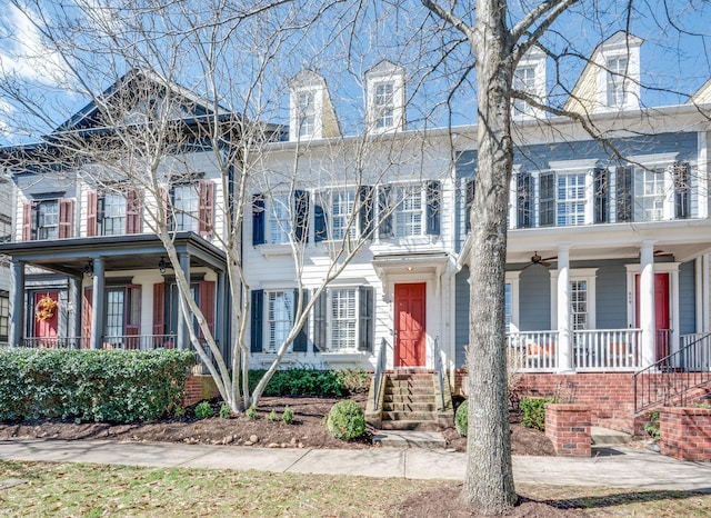 view of front of house with covered porch and a balcony