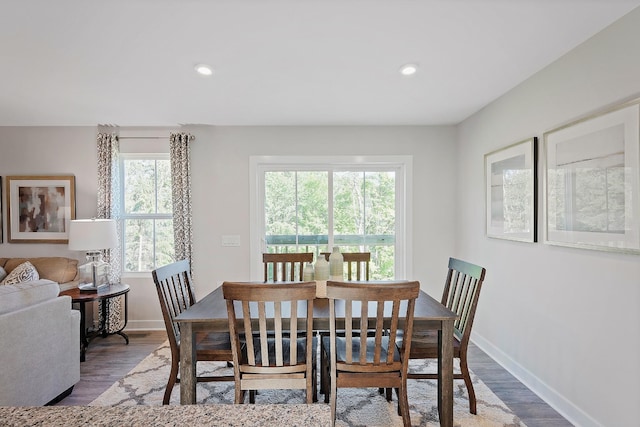 dining area with recessed lighting, wood finished floors, and baseboards