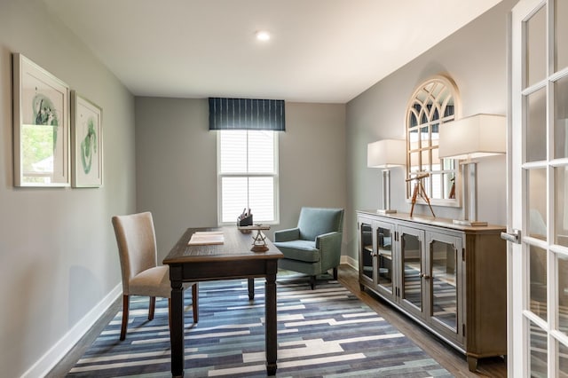 office with baseboards and dark wood-type flooring