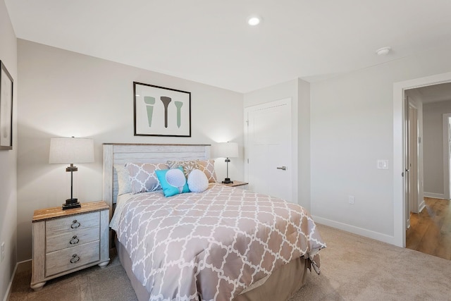 carpeted bedroom with recessed lighting and baseboards