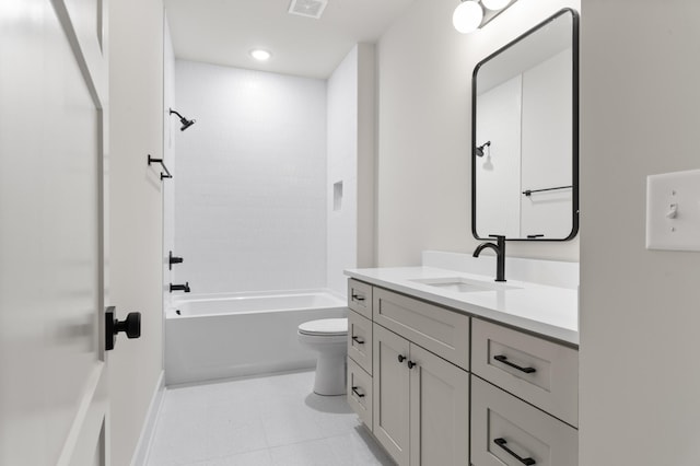 bathroom with shower / washtub combination, visible vents, toilet, vanity, and tile patterned floors