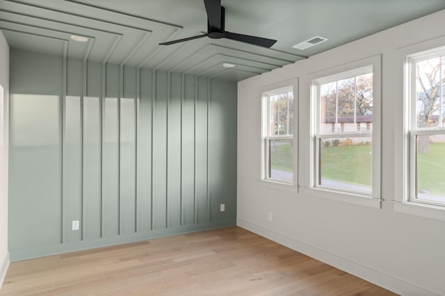 interior space featuring a healthy amount of sunlight, light wood-style floors, ceiling fan, and visible vents