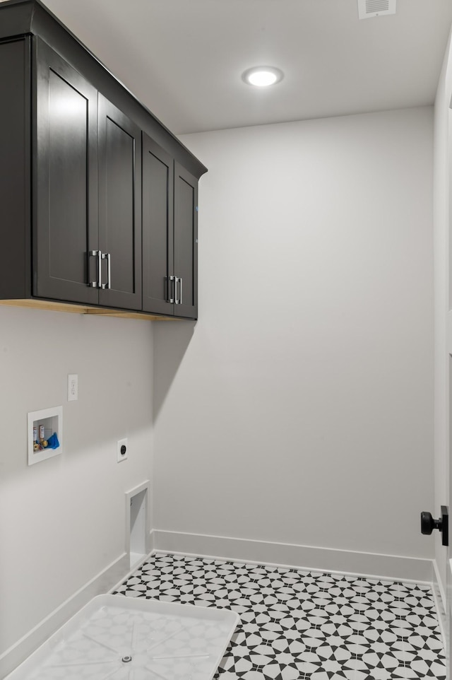 clothes washing area with cabinet space, visible vents, baseboards, hookup for an electric dryer, and washer hookup