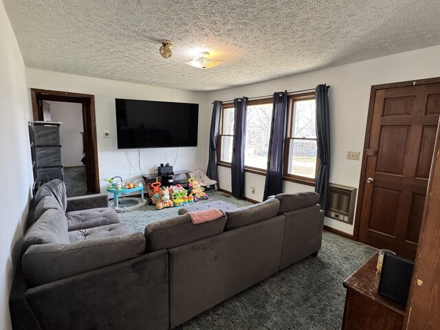 living area with carpet flooring and a textured ceiling