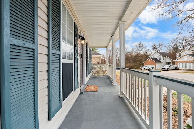 balcony with a residential view and covered porch