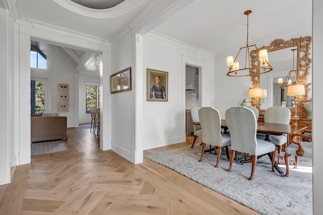 dining room with baseboards, a chandelier, vaulted ceiling, and crown molding