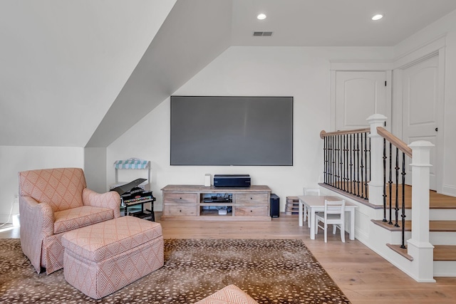 living room featuring wood finished floors, visible vents, and recessed lighting