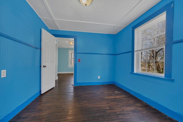 empty room featuring wood finished floors