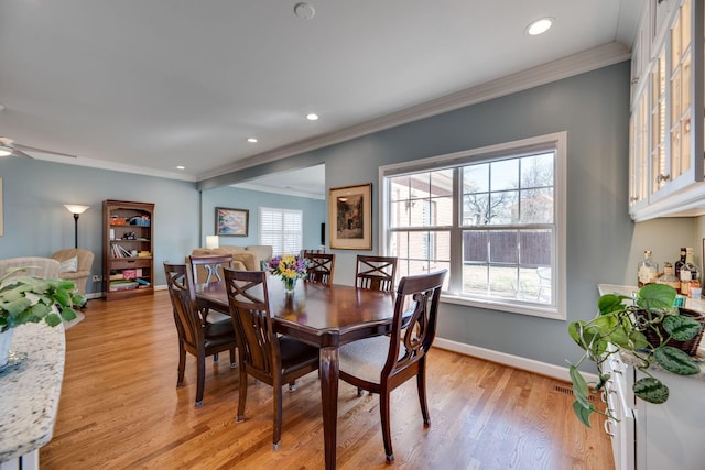 dining area with baseboards, a ceiling fan, ornamental molding, light wood-style floors, and recessed lighting