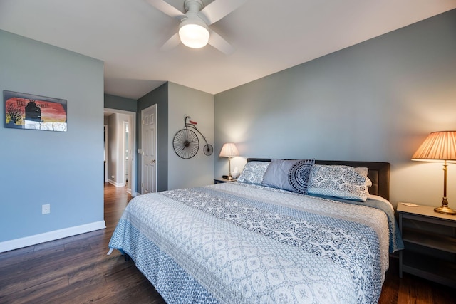 bedroom with ceiling fan, baseboards, and wood finished floors