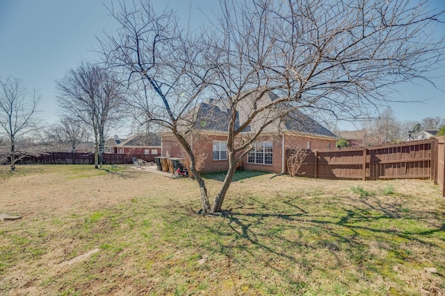 view of yard with a fenced backyard