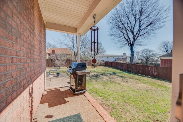 view of yard featuring a patio area and a fenced backyard