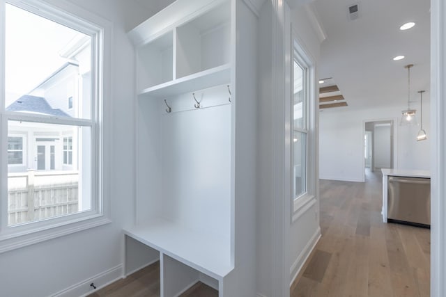 mudroom featuring light wood-style flooring, visible vents, baseboards, and recessed lighting