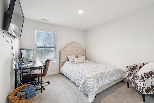 bedroom featuring baseboards, visible vents, and carpet flooring