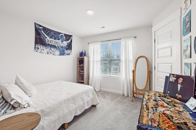 bedroom with carpet flooring, visible vents, and baseboards