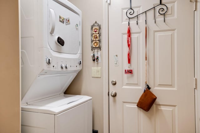 laundry room featuring laundry area and stacked washing maching and dryer