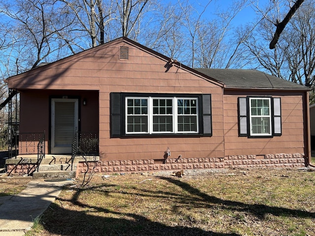 view of front of house with roof with shingles and crawl space