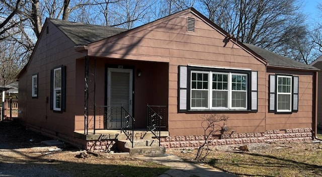 view of front of home featuring crawl space and a shingled roof