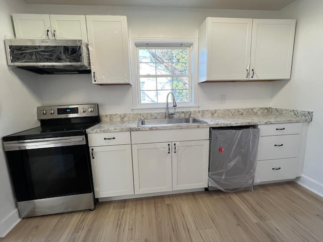 kitchen featuring a sink, stainless steel appliances, exhaust hood, and white cabinetry