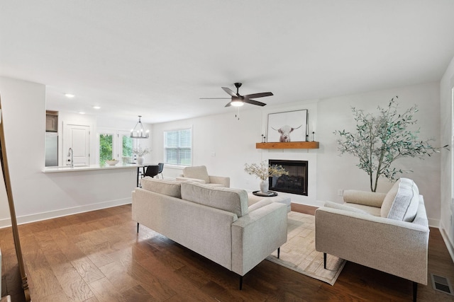 962 Belmont Rd, Clarksville, TN 37040 - living room featuring a glass covered fireplace, dark wood-style floors, a ceiling fan, baseboards, and recessed lighting