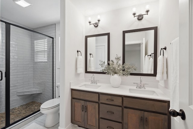 962 Belmont Rd, Clarksville, TN 37040 - full bathroom with double vanity, a stall shower, and toilet
