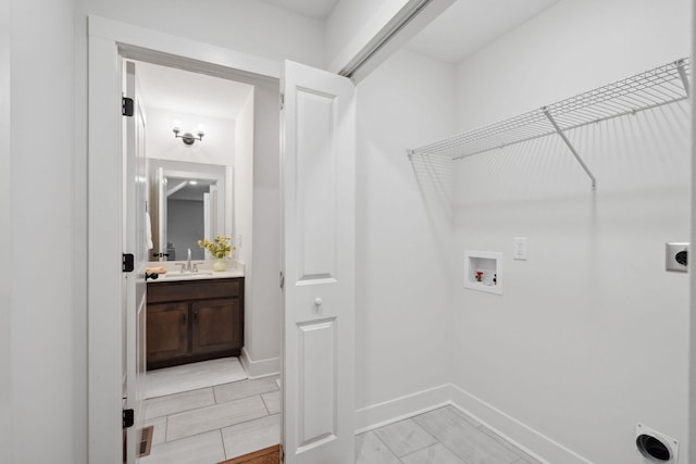 962 Belmont Rd, Clarksville, TN 37040 - laundry room featuring electric dryer hookup, washer hookup, and baseboards