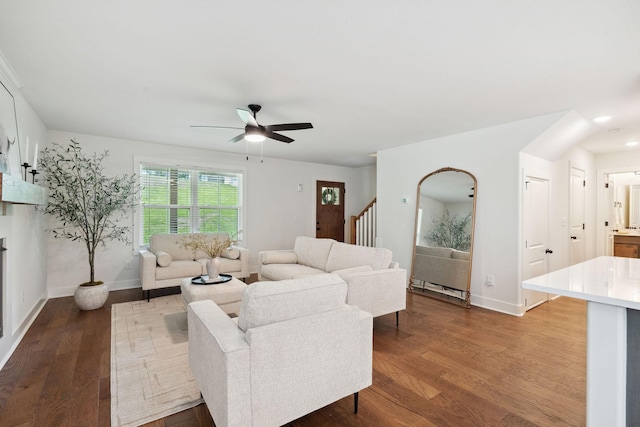 962 Belmont Rd, Clarksville, TN 37040 - living room featuring ceiling fan, dark wood-style floors, baseboards, and stairway
